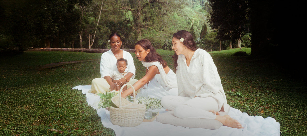 Family Wearing White Pieces of Indigo Luna in a Picnic Launch